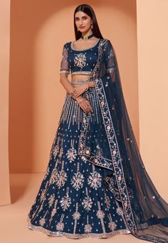 Blue net embroidered lehenga choli 1034  Desc:  Style : Circular Lehenga Choli Color : Blue Fabric : Net Work : Sequins   Thread   Embroidery Wash Care : Dry clean Sleeve Style : Half Sleeve Long Sleeves : Done only in Custom Stitch Sleeves Lining : Done only in Custom Stitch Bust Size : 32 to 42 Inches Occasion : Mehendi   Sangeet   Reception   Social Gathering   Gudi Padwa. With Express Free Shipping and Custom Stitching, Buy Indian Wedding Party Wear Lehenga Blue net embroidered lehenga choli Fancy Lehenga, Baju Kahwin, Indian Lehenga Choli, Net Blouses, Blue Lehenga, Net Lehenga, Lehenga Choli Online, Lehenga Collection, Indian Lehenga