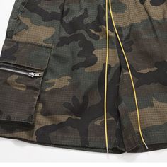 These camouflage cargo shorts allow for maximum mobility and breathability, thanks to their loose and relaxed design. With a stylish streetwear and high street pattern, this multi-pocket cargo short can help you dress to impress. Stand out in the crowd and show off your style. 60% cotton, 37% polyester, and 3% elastane Distressed Yellow drawstring closure Camouflage patten Elastic waist, drawcord, loose fit for comfort. Made from breathable, soft-washed material. Perfect for casual streetwear Si Urban Cargo Pants For Summer Outdoor Activities, Urban Style Summer Cargo Pants For Outdoor Activities, Urban Camouflage Cargo Pants With Side Pockets, Summer Military Cargo Pants With Cargo Pockets, Military Khaki Shorts With Pockets, Military Style Summer Cargo Shorts With Pockets, Combat Style Summer Cargo Pants With Pockets, Combat Style Cargo Pants With Pockets For Summer, Military Style Cargo Pants With Cargo Pockets For Summer