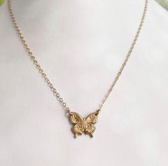 "This hand-made bronze medallion features a small butterfly, suspended from a fine 14k gold filled cable chain which is adjustable from 16-18\". A great everyday necklace! The medallion measures approximately 5/8\" diameter." Nickel Free Gold Butterfly Necklace, Dainty Adjustable Gold Butterfly Necklace, Gold Butterfly Necklace With Delicate Adjustable Chain, Gold Nickel-free Butterfly Necklace, Adjustable Gold Charm Necklace With Butterfly Charm, Mini Butterfly, Small Butterfly, Everyday Necklace, Mini Heart