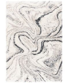 a white rug with black and grey swirls on the bottom, in an abstract pattern