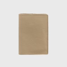 A beautiful leather passport cover is the perfect accessory to complete your look. Handcrafted from natural, soft-to-the-touch leather, the accessory is 2mm thick and holds its shape well. This cover is an essential item for the modern individual in their everyday life. It is practical to use and requires minimal upkeep. The leather cover makes for a versatile gift that is sure to be appreciated and put to use. The accessory is completely handmade and comes packaged in a craft box. As a customar Classic Beige Leather Wallet, Classic Beige Card Holder For Everyday Use, Classic Beige Wallet With Rfid Blocking, Beige Bifold Card Holder For Daily Use, Classic Beige Rfid Blocking Wallet, Minimalist Leather Bifold Card Holder, Classic Beige Card Holder For Travel, Classic Beige Bifold Card Holder, Beige Rectangular Card Holder For Travel