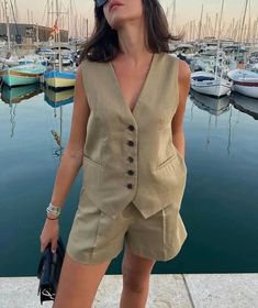 Elevate your summer style with our linen short set vest. Crafted from breathable linen fabric, this chic ensemble seamlessly combines comfort and sophistication. The versatile set features tailored shorts and a matching vest, perfect for a casual day out or a stylish evening affair. Embrace laid-back elegance with this must-have addition to your wardrobe. 🖤 DETAILS - Front button  - High waisted  - Invisible zip closure at font 🖤 SIZE XS Bust:  33.5" / 84cm Waist: 26" / 68cm Hips: 36" / 91cm S V-neck Workwear Sets For Summer, Spring Linen Beach Vest, Khaki Sets With Pockets For Spring, Linen V-neck Vest For Day Out, Chic Linen Vest For Day Out, Spring Workwear Sets In Khaki, Spring Workwear Khaki Sets, Summer Beach Linen Vest, Khaki Workwear Sets For Spring