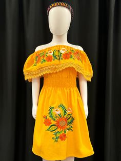 This beautiful embroidered Mexican floral dress with sunflowers and tulips is perfect for a special ocassion or fiesta. It has elastic on the waist. Sleeves can be worn up or down. Embroidered Flower Dress For Summer, Yellow Embroidered Fitted Dress, Orange Embroidered Fitted Dress, Fitted Yellow Dress With Floral Embroidery, Fitted Orange Embroidered Dress, Fitted Yellow Dress With Floral Applique, Fitted Embroidered Orange Dress, Spring Yellow Embroidered Dress With Short Sleeves, Yellow Embroidered Dress With Short Sleeves For Summer