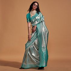 Rama Blue color saree is made from kanjivaram silk fabric which is highlighted with beautiful weaving work as shown. comes along unstitched jacquard blouse piece which you can customise as per your design/style. Occasion - You can wear this saree for festive and functions. Note:- the actual product may differ slightly in color and design from the one illustrated in the images when compared with computer or mobile screen. Measurements: Saree : KanjiVaram : 5.5 Mtrs Blouse : KanjiVaram Silk : 0.8 Mtr Material: KanjiVaram Silk Stitch Type: Unstitched Country of Origin: India Care Guide: Dry Clean Brocade Saree With Zari Weaving, Navratri Brocade Saree, Silver Art Silk Saree For Eid, Designer Silver Saree For Diwali, Silver Anarkali Saree In Traditional Drape, Anarkali Silver Saree With Traditional Drape, Brocade Pre-draped Saree With Zari Weaving, Silver Unstitched Saree With Zari Weaving, Silver Zari Weaving Unstitched Saree