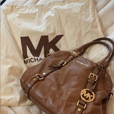 Brand New Michael Kors Brown Bag With Original Packaging Back Included. Brown Leather With Large Storage Compartment Michael Kors Gold Travel Satchel, Michael Kors Gold Satchel For Travel, Everyday Designer Michael Kors Bags, Designer Michael Kors Satchel With Removable Pouch, Designer Michael Kors Satchel With Handles, Designer Michael Kors Travel Satchel, Designer Michael Kors Satchel For Everyday Use, Michael Kors Gold Bag With Handles, Chic Michael Kors Brown Satchel