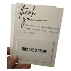 a hand holding a thank card with the words,'thank you your trust and remembrance is international to the success of my business '