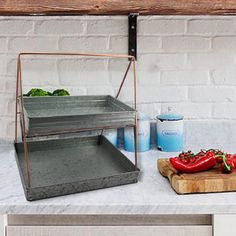 a kitchen counter with some food on it and a cutting board next to the counter