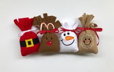 a group of small bags filled with different types of christmas decorations on top of each other