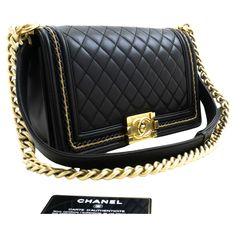 An authentic CHANEL Boy Chain Shoulder Bag Black Quilted Flap made of black Lambskin Leather. The color is Black. The outside material is Leather. The pattern is Solid. This item is Contemporary. The year of manufacture would be 2016. Conditions & Ratings Outside material: Lambskin Color: Black Closure: Turn Lock Hardware and chain: Gold-Tone Made in Italy Serial sticker: Attached Comes with: None Outside: 8 of 10 - Excellent condition with minimal signs of use. Inside: 8 of 10 - Excellent and very clean with small stains. No stickiness or peeling. Strap: 7 of 10 - Nice condition with normal signs of use. Partial tarnish on the chain. Hardware: 8 of 10 - Shiny and excellent condition with minimal signs of use. Approx. size: H5.7" x W9.8" x D2.6" (H14.5 x W25 x D6.8 cm) Approx. strap drop w Black Leather Bag With Gold Chain, Black Shoulder Bag With Chain, Authentic Boy, Luxury Black Bags With Gold Chain, Black Square Shoulder Bag With Chain, Luxury Black Shoulder Bag With Gold Chain, Chanel Vintage, Chanel Shoulder Bag, Bag Boys