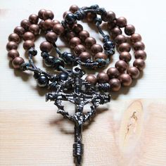 We thank you for looking at our rosaries. We have over 80 unique rosaries, using different color paracords, beads and High-quality Crucifixes. We are sure you will find the perfect one for you, and you'll love it. This beautiful prayer gives Jesus and Mary praise and deserves a rosary that represents the beauty of this prayer, which you can get in your favorite color. Our rosaries are unique and all handmade with love.- Beautiful and Unique design - Loose between beads which makes going from bea Saying The Rosary, Contemplative Prayer, Paracord Rosary, Jesus And Mary, Catholic Necklace, Praying The Rosary, Holy Rosary, The Cross Of Christ, Beautiful Prayers