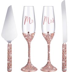 three wine glasses with matching utensils are shown in front of a knife and spatula