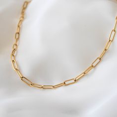 "Chunky and trendy, this necklace features thick chain links that measure 5 mm wide. 18K gold-plated stainless steel features a deeper, more saturated yellow color compared to 14K gold filled items. tarnish-resistant, water-resistant, and hypoallergenic. Lengths 13 inches and under will come with an additional 2 inch extension so that you can adjust it to fit perfectly and comfortably. --------------------♥ PROMOS ♥-------------------- Want 10% off? Join the mailing list by visiting http://bit.l Gold Paperclip Bracelet With Figaro Chain Links, Gold Chain Link Paperclip Bracelet, Minimalist Paperclip Necklace With Chunky Chain, Paperclip Link Bracelet As Gift, Gift Paperclip Chain Link Bracelet, Gold Paperclip Chain Link Bracelet, Gold Paperclip Chain Bracelet As Gift, Chunky Chain Oval Link Paperclip Bracelet, Paperclip Bracelet With Cable Chain As A Gift