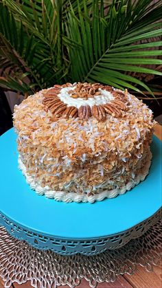 a cake on a blue plate sitting on a table