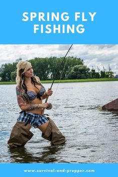 a woman is standing in the water while holding a fishing rod and wearing cowboy boots