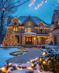 a large house with christmas lights on the front