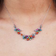 The delicate silver-plated Firefly Multicolor Petite Scallop Necklace brings a unique symmetry to your daily style. It is inset with a combination of Swarovski crystals and fire-polished Czech glass beads, all crafted carefully by Guatemalan artists. Geometric shapes merge with beautiful, bright beads to create a mesmerizing vision! Color: Multicolor Silver-plated, antiqued, hypoallergenic steel chain, setting, and clasp Clean with a soft jewelry polishing cloth. Never clean with any chemicals, Multicolor Crystal Necklace With Sparkling Stones, Silver Multi-stone Crystal Jewelry, Fusion Style Multi-stone Necklaces, Fusion Style Multi-stone Necklace, Multicolor Nickel-free Crystal Necklaces For Jewelry Making, Multicolor Crystal Pendant Jewelry, Nickel-free Multicolor Crystal Necklaces, Silver Multi-stone Necklace For Parties, Elegant Silver Crystal Necklace With Colorful Beads