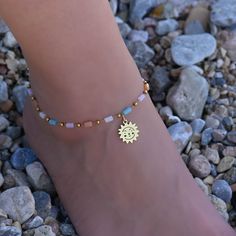 This beaded gold sun anklet is for women. Its boho style makes it a great piece of beaded summer jewelry. The ankle bracelet has an extension so the size can be adjusted. Gold Beaded Bracelets For Summer Beach, Beaded Gold Anklets For Summer, Gold Beaded Bracelets For Summer, Summer Gold Beaded Bracelets For Beach, Bohemian Beaded Chain Anklets For Festivals, Summer Beaded Gold Anklets, Bohemian Beaded Anklets For Beach, Summer Beach Gold Beaded Bracelets, Bohemian Sun Design Jewelry For Beach