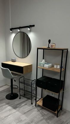 a hair salon with a mirror, chair and shelf