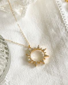 First the moon, then the sun. Add the Sun Necklace to your collection today. Cubic zirconia sun Charm size: 19.5x22.5mm 14kt Gold plated brass pendant & gold filled chain All items come in a gift box ready to gift. To see more please visit my Etsy shop at https://www.etsy.com/shop/BijouLimon Bijou Limon jewelry collections present a romantic French spin on the latest jewelry trends. Based on the US West Coast but French at heart, Bijou Limon interprets the current jewelry trends and delivers tim Celestial Sun Design Round Jewelry, Round Adjustable Necklace With Sun And Moon Design, Adjustable Round Sun And Moon Design Necklace, Celestial Cubic Zirconia Pendant Necklace, Celestial Cubic Zirconia Round Necklace, Sun And Moon Design Necklace For Gift, Sun And Moon Design Necklace As Gift, Spiritual Round Cubic Zirconia Necklace, Gift Moon And Sun Design Necklaces