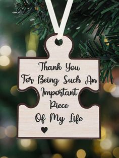 a wooden ornament hanging from a christmas tree with the words thank you for being such an important piece of my life