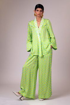 Green top with geometric print and embroidery details on the shawl collar. Paired with a matching printed pant and belt. - Aza Fashions Green Silk Workwear Sets, Spring Silk Workwear Set, Silk Sets With Straight Pants For Workwear, Spring Silk Fitted Palazzo Set, Fitted Silk Palazzo Set For Spring, Chic Festive Sets With Straight Pants, Designer Long Sleeve Sets For Spring, Traditional Spring Workwear Sets, Spring Palazzo Set For Work