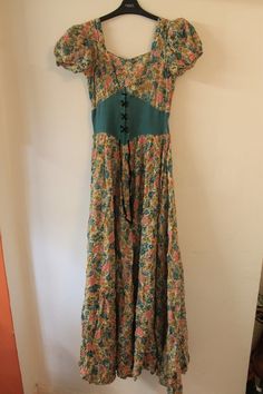 Really beautiful floral maxi dress, from the 1940s but has a real 60s/70s look to it also. 24 inch waist. 60 inches from shoulder to hem There are parts where it is coming apart at the seams a little as shown in the last picture, but this is very easily fixed. 1940s Looks, 70s Look, 70s Maxi Dress, Corset Waist, Garden Party Dress, Floral Maxi, Floral Maxi Dress, Dresses Xs, Garden Party