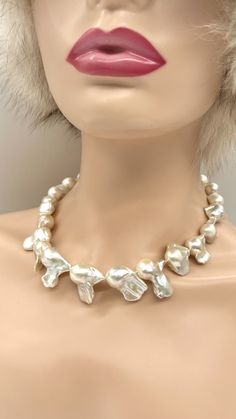 A one of a kind baroque pearl necklace with beautiful lustre and amazing baroque shape pearls, white color with only few blemishes. Handpicked Baroque Pearl! Statement large baroque necklace, Hand knotted necklace with a white silk thread. This necklace is 19 inches long. Smallest pearl is 11x18mm up to 18x30mm approximately.  Clasp is magnetic alloy gold plated encrusted with cubic zirconia 13.5mm size. These are real freshwater pearls, often irregular in shape, no two freshwater pearls are ide White Pearl Pendant Necklace For Party, Party Pearl Necklace With Baroque Pearl Charm, Party Pearl Necklace With Baroque Pearl Pendant, Party Pearl Necklace With Baroque Pearl Drop, Baroque Pearl Necklace With Pearl Charm For Party, Party Pearl Drop Necklace With Baroque Pearls, Baroque Silver Pearl Drop Necklace, White Pearl Necklace With High Luster For Anniversary, White High Luster Pearl Necklace For Anniversary