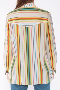 "Vintage 70s shirt in white with rainbow stripes. Buttons down the chest with long sleeves and a collar. Every garment we sell is authentic vintage and one-of-a-kind! You will receive the exact item photographed. Condition: Very good vintage. Best fits women's: Small to medium Material: Feels like Polyester MEASUREMENTS Taken from seam to seam while the garment is lying flat. Double the armpit, waist, and hips For reference, model is 5'5\" and measures 32-24-34. Length from Top: 27\" Armpit to A Babydoll Dress Grunge, Grunge Dress 90s, 70s Shirts, Hippie Tops, 70s Boho, Rainbow Shirt, Retro Tee, Striped Blouse, Rainbow Stripes