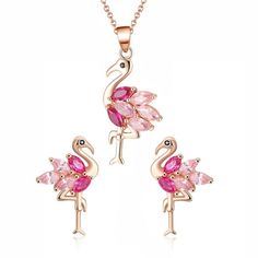 Bring a splash of playful elegance to your ensemble with the Pink Flamingo Bird Necklace and Earrings Set from the Ginger Lyne Collection. This delightful set embodies the whimsical charm of the flamingo, beautifully crafted in sterling silver and adorned with two-tone pink cubic zirconia that captures the essence of these enchanting birds. The set includes a pendant measuring 34mm (approximately 1.34 inches) and matching earrings that are 17mm (approximately 0.67 inches) in length. Each piece i Pink Jewelry Sets For Valentine's Day, Pink Jewelry Sets For Valentine's Day Party, Party Rose Gold Dangle Jewelry Sets, Pink Jewelry Sets For Mother's Day, Pink Jewelry Sets With Matching Earrings As Gift, Pink Dangle Jewelry Sets For Gifts, Pink Flamingos Birds, Bird Shape, Vacation Jewelry