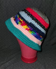 Uniquely handcrafted crocheted bucket hat. Yarn is comprised of different yarn from my project leftovers.  Made from 100% acrylic yarn.  From top to bottom, hat is approximately 9 inches.  Across it is 9 inches and the brim is 12 inches across and 3 inches tall when hat is laying flat.  This hat will fit any size teenage/adult head but if your head is on the big side it will stretch.  Keeps the sun out of your eyes on a sunny day, and brim of hat can be manipulated into different styles (flipped Crocheted Bucket Hat, Fedora Style, Crochet Bucket, Crochet Bucket Hat, Bucket Hats, Sunny Day, Acrylic Yarn, Your Eyes, Sunny Days