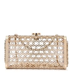 This is an authentic CHANEL Metal CC Moucharabieh Minaudiere Crossbody in Gold. This stunning piece is crafted of gold metal with a leather threaded gold chain shoulder strap and Chanel CC closure hardware. Elegant Gold-tone Chain Link Jewelry With Logo Plaque, Elegant Gold-tone Chain Link Jewelry, Chic Gold-tone Evening Jewelry, Yellow Gold Jewelry With Chain Strap For Evening, Yellow Gold Jewelry With Gold-tone Hardware For Evening, Designer Gold-tone Evening Jewelry, Designer Gold-tone Jewelry For Evening, Elegant Evening Jewelry With Gold Clasp, Gold Jewelry With Gold-tone Hardware For Party