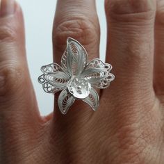 "Orchid Ring - Sterling Silver Ring - Filigree Ring - Flower Ring - Handmade Ring - Silver Art - Filigree Jewelry - Gift Idea for Her Filigree - delicate jewellery technique made from silver or golden threads \"embroidering\" kind of metalwork lace that is specific to Spain, especially an Andalusian town Cordoba, where they call it a cordobese filigree. This craftsmanship has been passed from generation to generation, nonetheless nowadays there are very few craftsmen left who know to perform suc Delicate Flower-shaped Rings As Gifts, Delicate White Flower Shaped Ring, Delicate White Flower-shaped Ring, Handmade Delicate Flower Ring For Wedding, Sterling Silver Butterfly Ring For Wedding, Delicate Handmade Flower Ring For Wedding, Unique Sterling Silver Butterfly Ring For Wedding, Handmade Flower-shaped Wedding Rings, Delicate White Flower Ring For Wedding