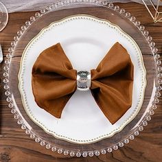 a white plate topped with a brown bow tie