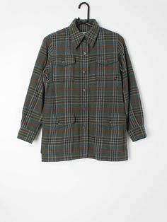 Womens vintage Saint Laurent plaid flannel shirt. Pure wool, made in France circa 1970. Our recommended size: XS to Small (Please check specific measurements below) Label Says: no size shown Condition: very good; has had one small hole repair on the bottom pocket on the front which is barely noticeable amidst the overall pattern. Please see photos. Material: 100% wool Measurements in inches: Pit to pit: 18.5 Shoulders: 14 Front length: 27 Back length: 27 Sleeve length: 215 We've provided garment Wool Button-up Flannel Shirt For Fall, Fall Wool Button-up Flannel Shirt, Wool Flannel Button-up Shirt For Fall, Classic Wool Flannel Shirt With Pockets, Classic Plaid Shacket With Pockets, Plaid Wool Long Sleeve Shirt, Classic Plaid Wool Flannel Shirt, Classic Wool Plaid Flannel Shirt, Wool Button-up Shirt For Fall