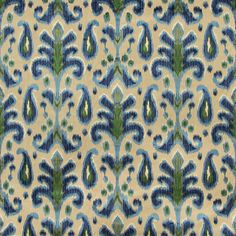 a blue and green pattern on fabric