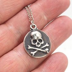 This solid sterling silver Skulbones coin pendant is wax carved by hand and cast using the ancient process of Lost Wax casting. I then made a mold, which I can inject with wax and make wax copies of the Skull and Crossbones Coin and cast a lot of them for all y’all! Once cast, I clean them up, polish, texture and then oxidize the background and polish the skull and bones. Then I add a layer of Renassaince Wax to keep the patina as dark as possible for as long as possible. The oxidized patina wil Wax Carved Ring, Wax Carving, Wax Casting, The Skull, Lost Wax Casting, Line Shopping, Skull And Crossbones, Skull And Bones, Lost Wax