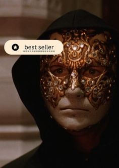 a man wearing a mask with the words best seller written on it in front of his face