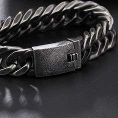 A punk rock style accessory that looks fierce in any venue from a concert to a backyard bash; embrace the rock and roller within each time you rock this vintage bracelet on your arm. ✔ Condition: 100% Brand New and High Quality✔ Made of 316L Stainless Steel and Genuine Leather✔ Available in 12 and 15mm width✔ Length is 21.5cm✔ Weighing in at an impressive around 101 grams✔ Packaging comes in gift bag Metal Punk Cuff Bracelet For Festival, Punk Metal Cuff Bracelet For Festivals, Black Punk Chain Bracelet As A Gift, Black Punk Style Chain Bracelet For Gift, Black Punk Style Chain Bracelet As Gift, Punk Style Black Chain Bracelet Gift, Black Rock Style Jewelry For Streetwear, Rock Style Black Jewelry For Streetwear, Silver Punk Style Wristband Gift