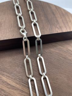 925 Silver Chain Paper Clip Chain 7.2x20mm chain  PRODUCT DESCRIPTION Materials:Silver 925 -Color:White silver,if you need Oxidized(Dark silver) color,please leave message. -Width:7.2x20mm each link -Length:Any length (Can be personalized length) -Clasp can change to other designs. Jump ring:5-6mm.It depends on the chain width.Pleace check your pendant bail to see if can get through it.If you need smaller jump rings,please contact us. All the jump rings will be soldered before we send it to you. Sterling Silver Bracelet With Cable Chain Design, Sterling Silver Bracelet With Oval Link Paperclip Chain, Sterling Silver Bracelet With Rectangular Links And Clasp, Sterling Silver Bracelet With Cable Chain, Sterling Silver Bracelet With Paperclip Chain, Sterling Silver Link Bracelet With Silver Chain, Sterling Silver Oval Link Chain Bracelet, Rectangular Sterling Silver Chain Jewelry, Classic Sterling Silver Link Chain Necklace