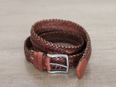 "Handmade by us from thick hand weaving, design and care. The brandy colour leather is vegetable tanned, it will shine and flourish as it is used. *If you want, I can remove the brand (logo) on the front, just send a message *An elegant belt to be used for many years *It can be used for either men or women. *No holes, can be installed anywhere. *All Belt buckles color is smoked black. SİZE : Width of the belt 1.3 inch/ 3.4cm IMPORTANT! It is the size of the BELT, not your waist or pant. size you Father Of Groom Gift, Elegant Belt, Leather Accessories Handmade, Belts Men, Braided Leather Belt, Belt For Men, Beautiful Belts, Leather Belts Men, Woven Belt