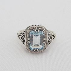 Vintage Sterling Silver Aquamarine Filigree Ring ...Marked 925...Total of weights 2.3grams...Size 9...Measure of Face 12mm...It's in good condition Art Deco Blue Topaz Ring With Center Stone, Classic White Gold Blue Topaz Birthstone Ring, Classic White Gold Birthstone Ring With Blue Topaz, Elegant Sterling Silver Signet Ring With Center Stone, Formal Sterling Silver Birthstone Ring With Accent Stones, Formal Sterling Silver Birthstone Ring, Classic Silver Blue Topaz Birthstone Ring, Elegant Sapphire Signet Ring Hallmarked, Elegant Blue Topaz Signet Ring With Gemstone