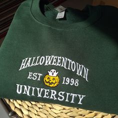 Halloweentown embroidered sweatshirt, Vintage spooky season sweatshirt, embroidered halloween university sweatshirt, halloweentown university sweatshirt, Spooky pumpkin ghost sweatshirt, Vintage halloweentown university crewneck I've included images showing the design on a Forest Green Sweatshirt, please message me for specific sweatshirt colour requests/a request for changing the embroidery colour. Check out our Shop filled with so many Designs! https://www.etsy.com/uk/shop/TahikoStitch ⬅️⬅️⬅️ Fall School Spirit Embroidered Sweatshirt, Fall College Sweatshirt With Embroidered Text, College Fall Sweatshirt With Embroidered Text, Fall School Spirit Sweatshirt With Embroidered Graphics, Varsity Sweatshirt With Custom Embroidery For Fall, Fall Campus Tops With Embroidered Graphics, Fall School Spirit Sweatshirt With Custom Embroidery, Custom Embroidery School Spirit Sweatshirt For Fall, Custom Embroidered Sweatshirt For School Spirit In Fall