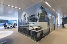 an office with large wall graphics on the walls