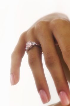 a woman's hand with a ring on it