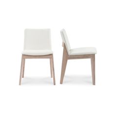 two white chairs sitting next to each other