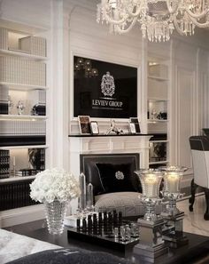 a living room filled with furniture and a chandelier