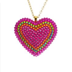 The Electric Koolade pendant embraces the trippy beauty of color-shifting crystals. Featuring over three hundred hand-placed crystals, this psychedelic combination of hot pink, rose, orange, and vitrail crystals will add a punch of color to any look. DETAILS Heart Charm: 2” wide Chain: 18” chain + 2" extender Made to order. Please allow 1-2 weeks for delivery. SIZE CHART Heart Charm Pendant Necklace For Party, Heart Pendant Necklace With Charm For Party, Pink Crystal Heart Pendant Jewelry, Pink Crystal Heart Pendant Necklace, Party Necklace With Heart Pendant And Beads, Party Necklaces With Heart Beads And Pendant, Pink Heart-shaped Jewelry With Sparkling Stones, Valentine's Day Heart Pendant Necklace For Party, Party Jewelry Heart Pendant With Bling