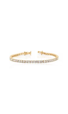 Give the gift of eternal luxury with this stunning 7" diamond tennis bracelet. Adorned with sustainable lab-grown, round cut, 9.25 carats, E/F color, VS clarity diamonds in a 4-prong setting on 14K yellow gold, this gorgeous stackable piece is the perfect present for loved ones or even yourself. *Note: Please inquire with customerservice@generationloveclothing.com if you would like a different size. Lead time for inquiries will take up to 3 weeks. 7 day return for store credit only. No exchanges Bridal Wardrobe, Flowy Gown, Streetwear Chic, Diamond Tennis Bracelet, Tennis Bracelet Diamond, Fine Jewelry Collection, Tennis Bracelet, Lead Time, 3 Weeks