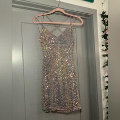 Nwt Strappy Sequin Mini Dress, Never Worn. Perfect For Holiday Season Or New Year’s Eve Nonsmoker And Pet Free Household Sparkling Silver Sequin Dress For Homecoming, Silver Sparkling Sequin Dress For Homecoming, Silver Sequined Mini Dress For Homecoming, Silver Sleeveless Dress For Homecoming, Silver Mini Dress For Homecoming, Silver Mini Length Dress For Homecoming, Silver Summer Homecoming Dresses, Silver Dresses For Summer Homecoming, Silver Sleeveless Mini Dress For Homecoming