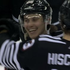 two hockey players standing next to each other